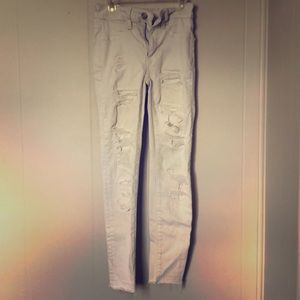 Ripped jeans with fabric behind the rips